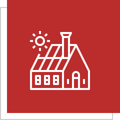 House with solar panels on red background.